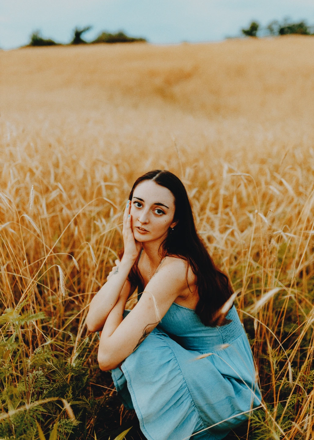 A portrait in a golden field with Gold 200 film colour