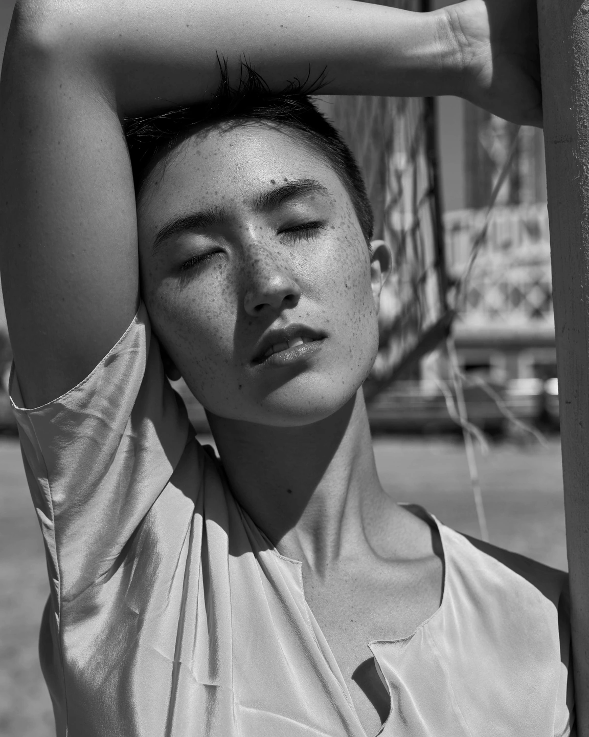 Sunlit close-up portrait rendered in black and white