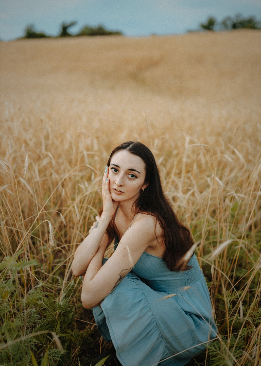 Portrait in a summer field with gently darkened outer edges